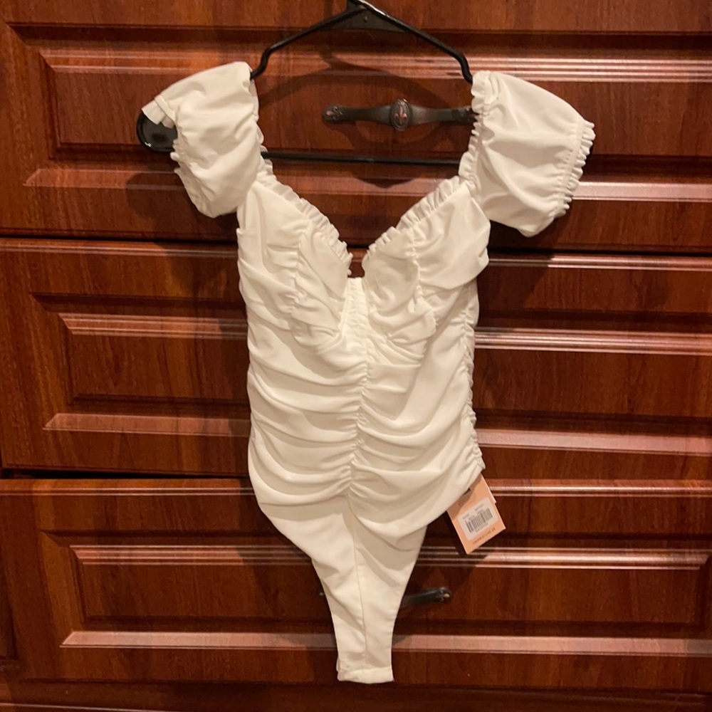 Tiger Mist Pierre Bodysuit in size small. The sleeves can be worn up or down.